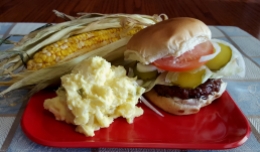 Grilled Hamburger with Corn on the cob and Potato Salad